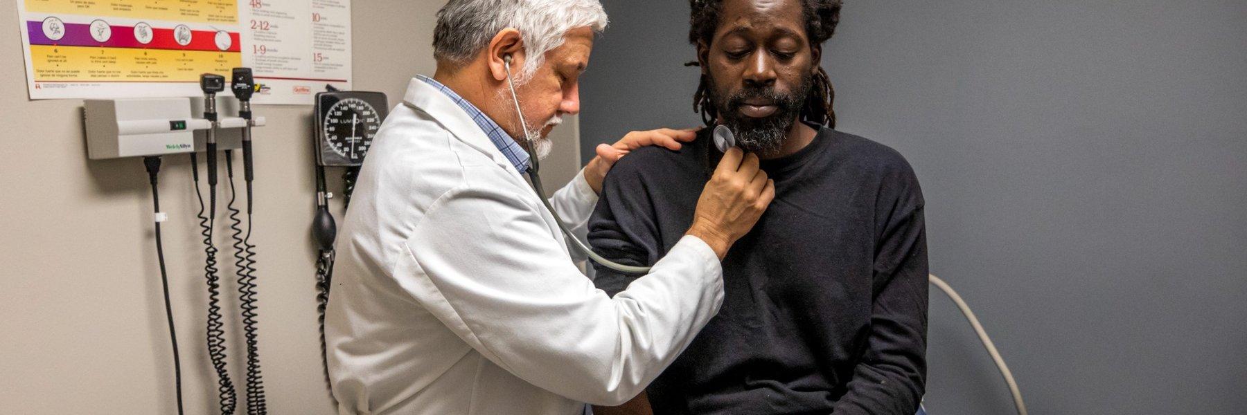 Dr. Quintero checking a patient 