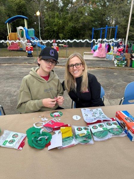 Class of 2024 Kayla Schusterman and her son worked hard with the families.
