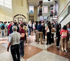 Students waiting to load buses inside COM Lobby
