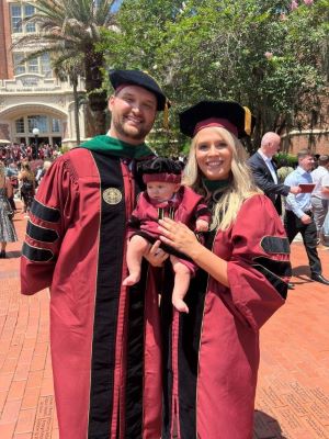 Drs. Jared and Lethia Wainwright and their son, James, decked out in the same FSU regalia as his parents, courtesy of maternal grandmother Angela Johnson.