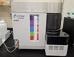 Cytek Aurora machine on black lab bench