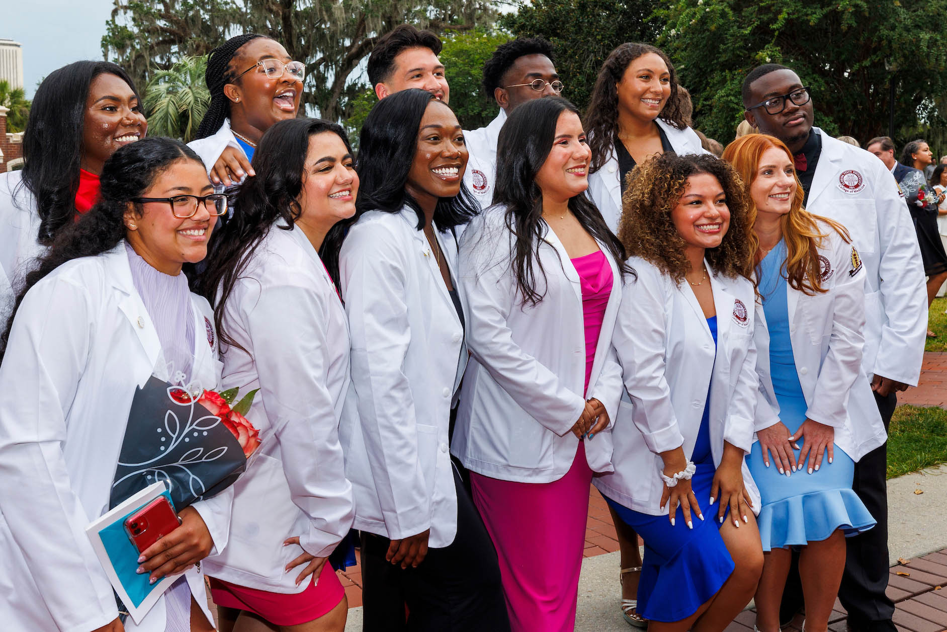 First-year medical students who graduated from the Bridge program in May gather for a group photo near the Westcott fountain. 
