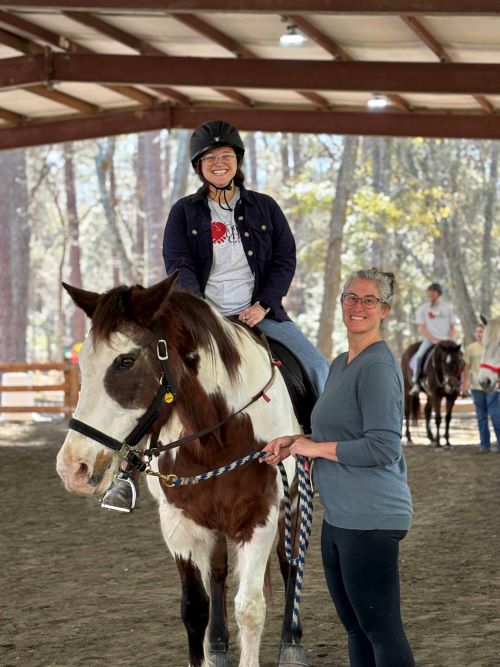 Student, Madison McCraney, riding a horse.