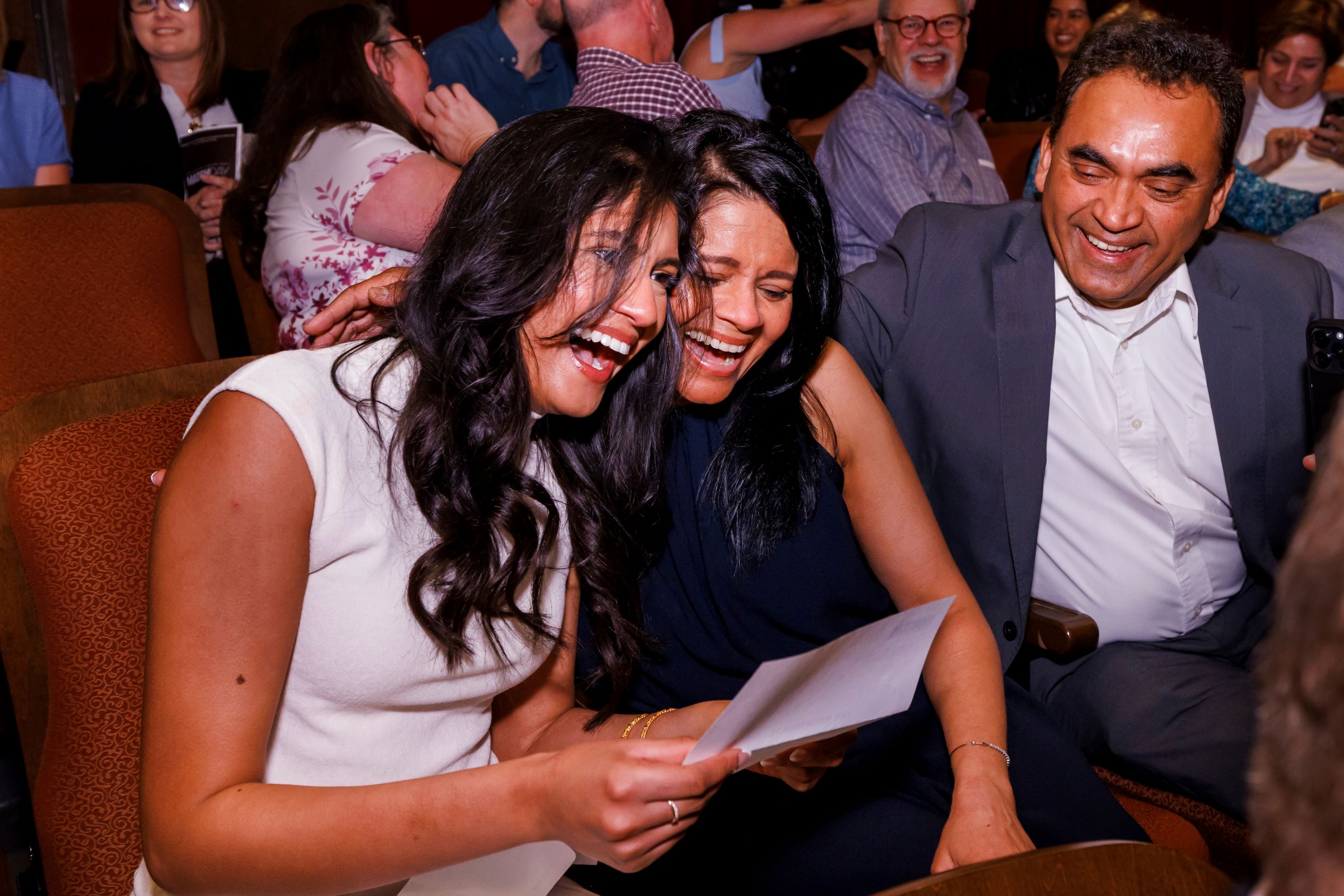 Shea Perera and her parents open and read her match letter.