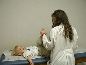 Doctor examing a toddler