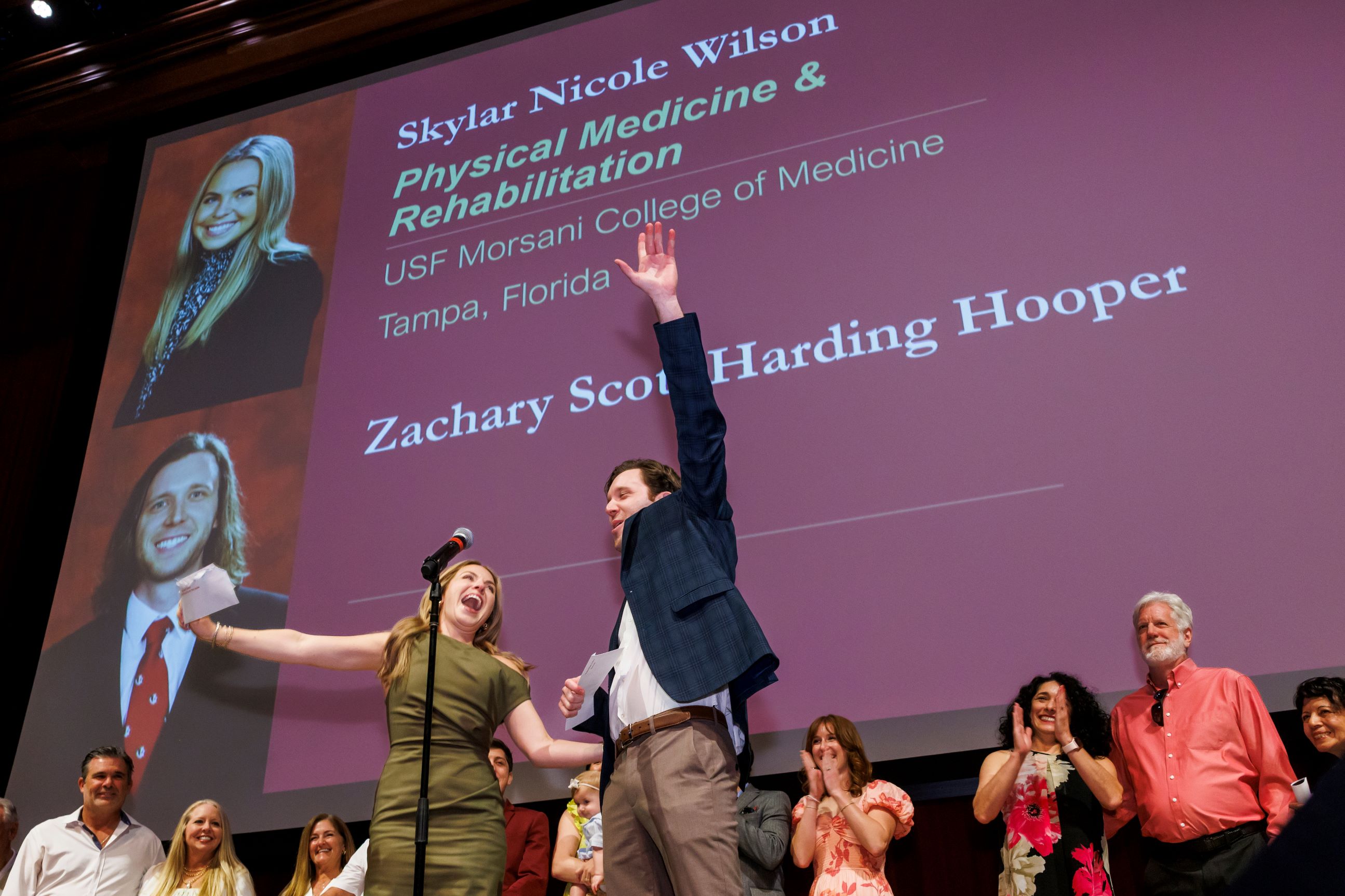 Skylar Nicole Wilson and Zachary Scott Harding Hooper scream for joy as they reveal they "couples-matched" into the same residency program. Their families joined them on stage.
