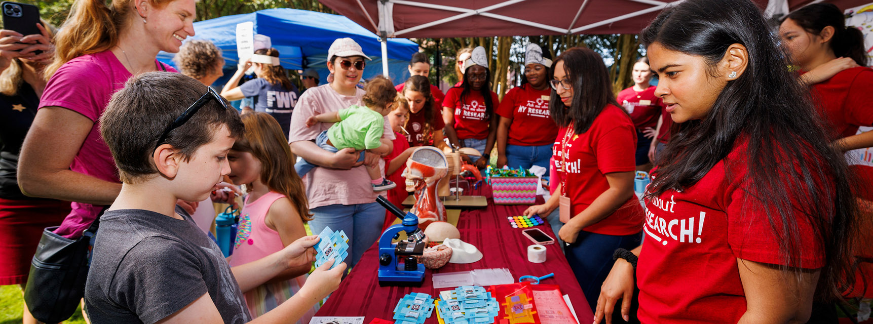 College of Medicine students interact with children at the Tallahassee Science Festival