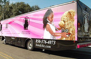 Image of the bus that serves as the Bond Community Health Center's mobile unit.
