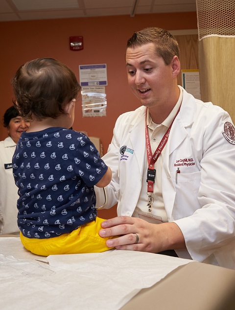 resident checking toddler