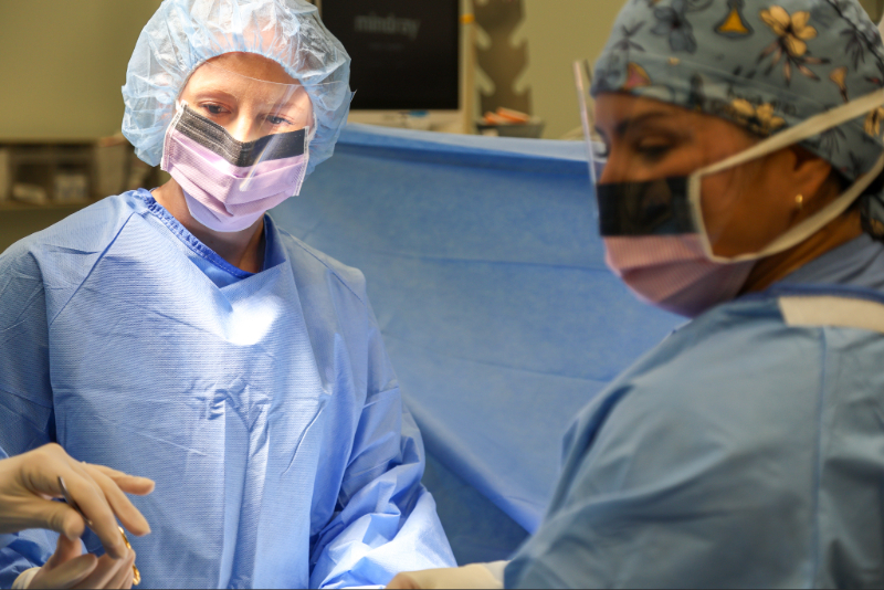 Residents perform surgery