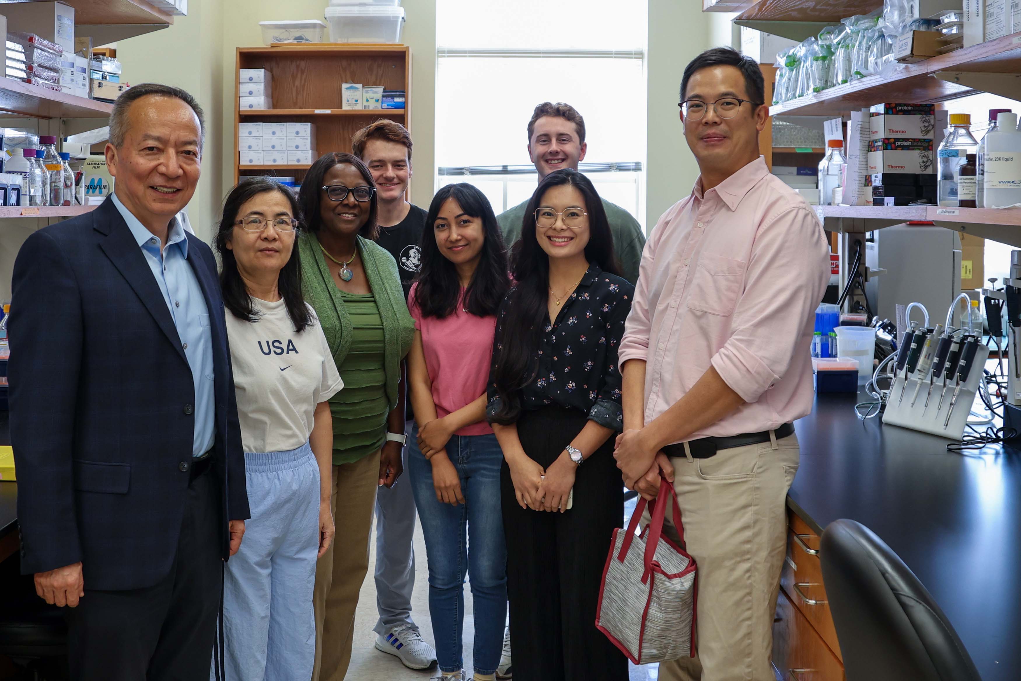 From left: Xian Jin Xie, senior associate dean for research and graduate programs; Yueling Hao, research assistant in the Julia Wang lab; Dr. Alma Littles, dean of the College of Medicine; Carson Mickey, graduate student in the Wang lab; Jyoti JC, research assistant in the Wang lab; Ryan Kiddle, graduate student in the Irianto lab; Hyeje Sumajit, graduate student in the Irianto lab; and Jerome Irianto, Ph.D., assistant professor of biomedical sciences.