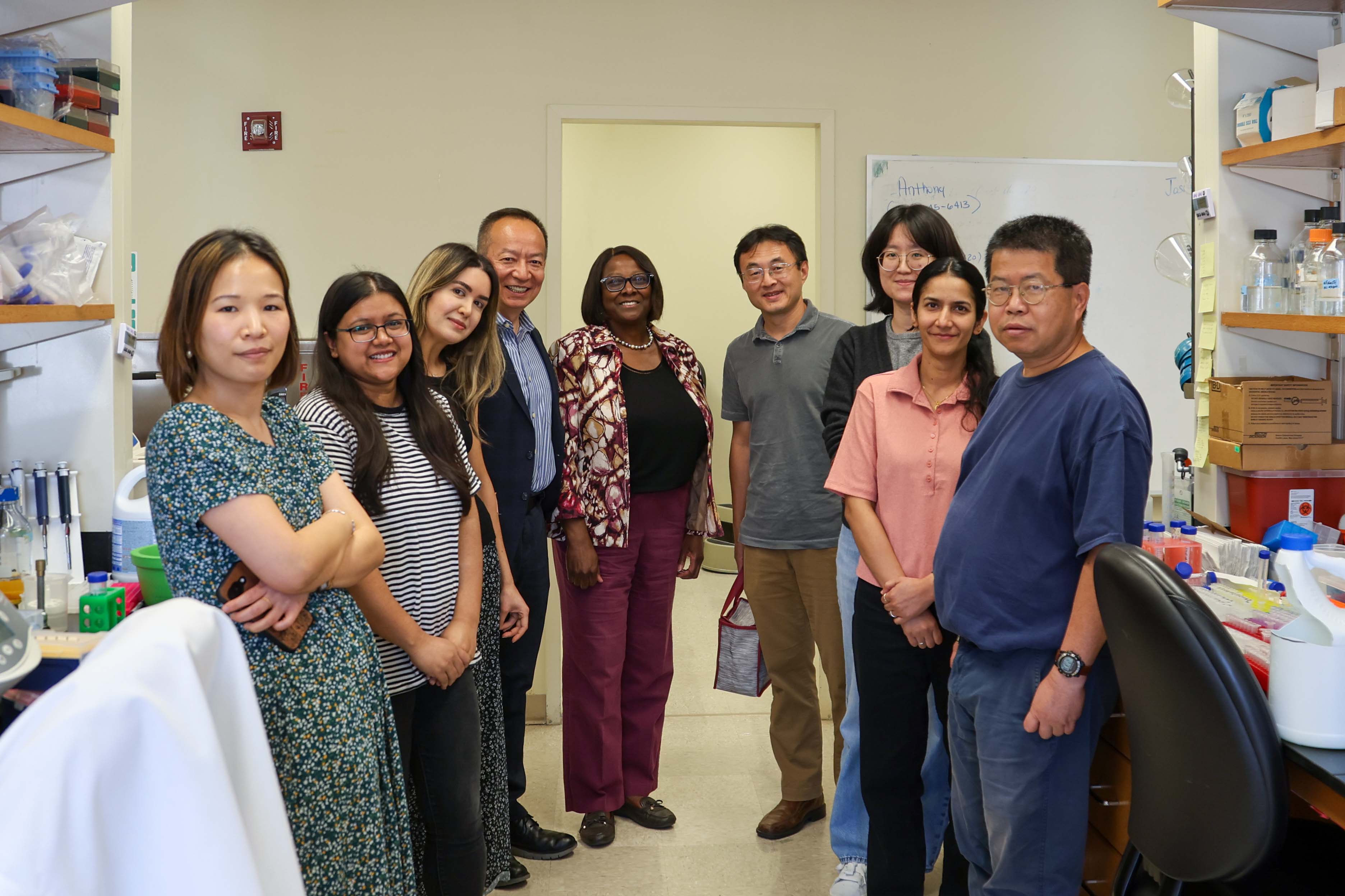 Dean Littles and Xian Jin Xie pictured with the Jia lab members after presenting a gift for recent R01 funding. 