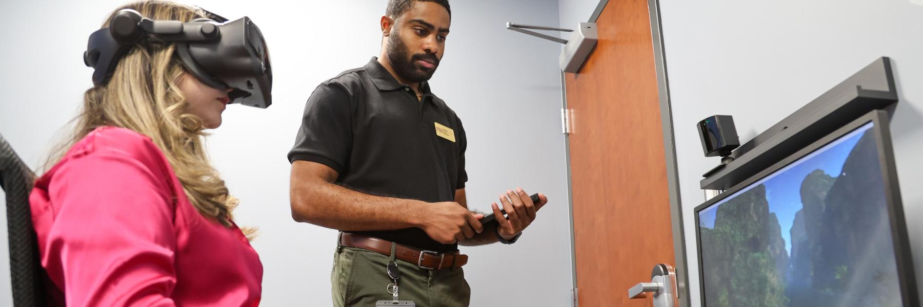 image of staff doing VR guided mindfulness with a fake participant
