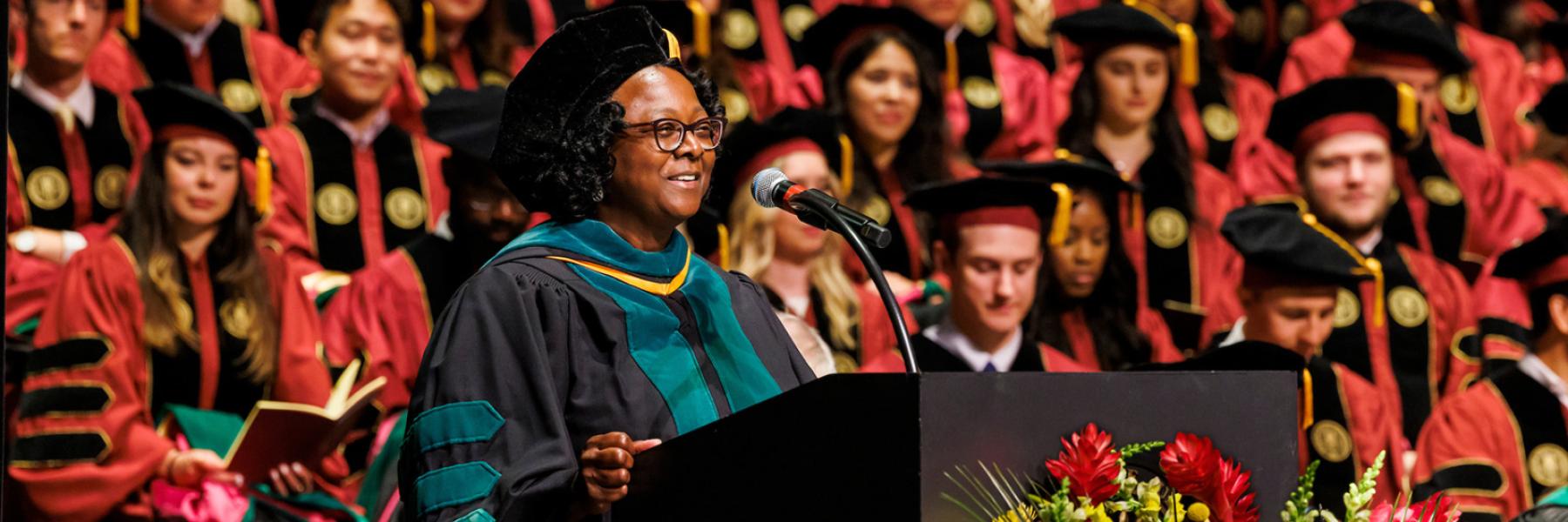 Interim Dean Alma Littles leads the College of Medicine commencement ceremonies May 20, 2023.