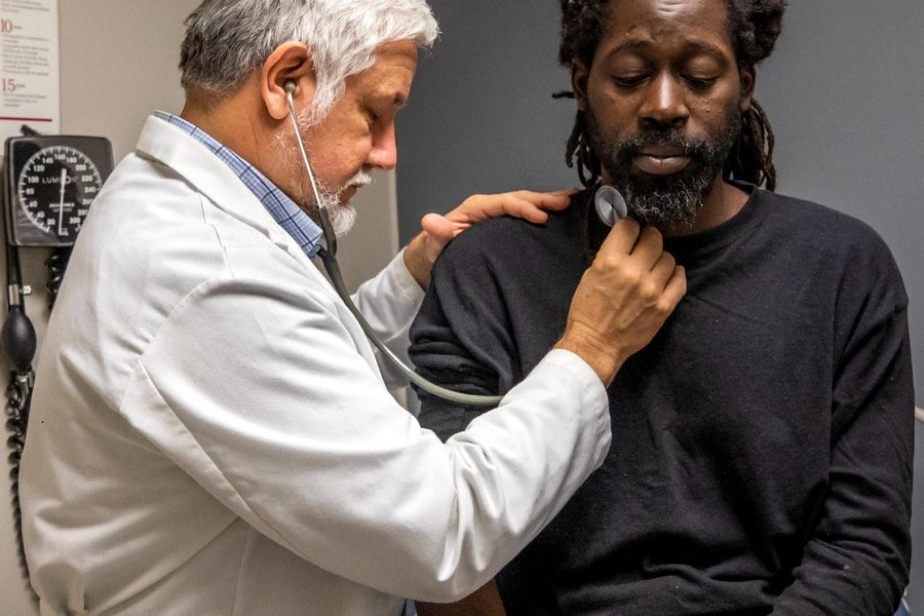 Dr. Quintero checking a patient 