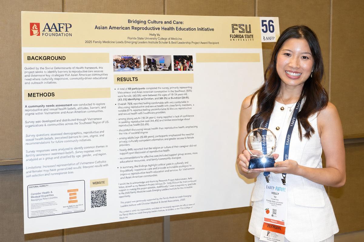 Holly with her award and poster