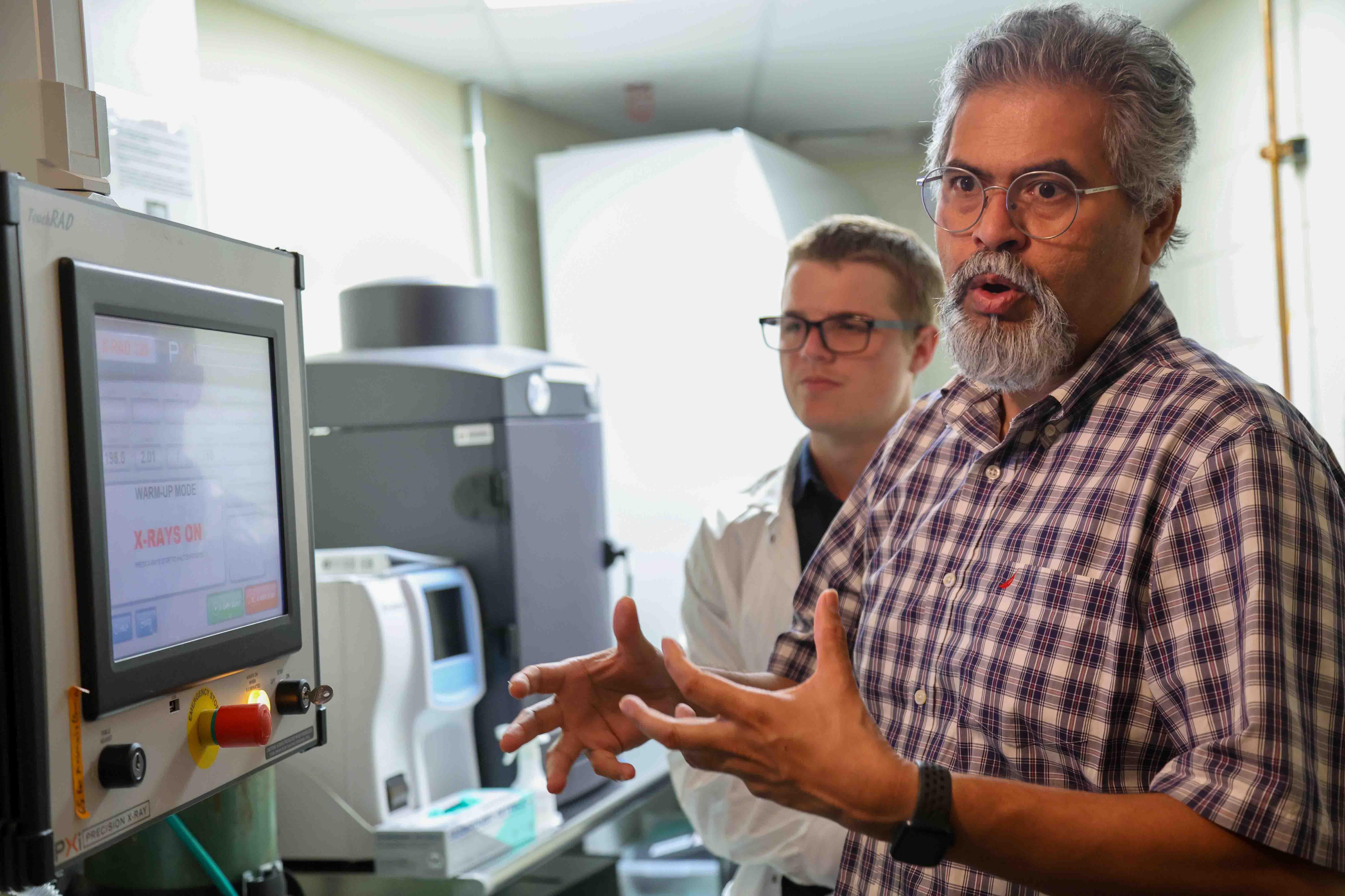 Professor and student in lab