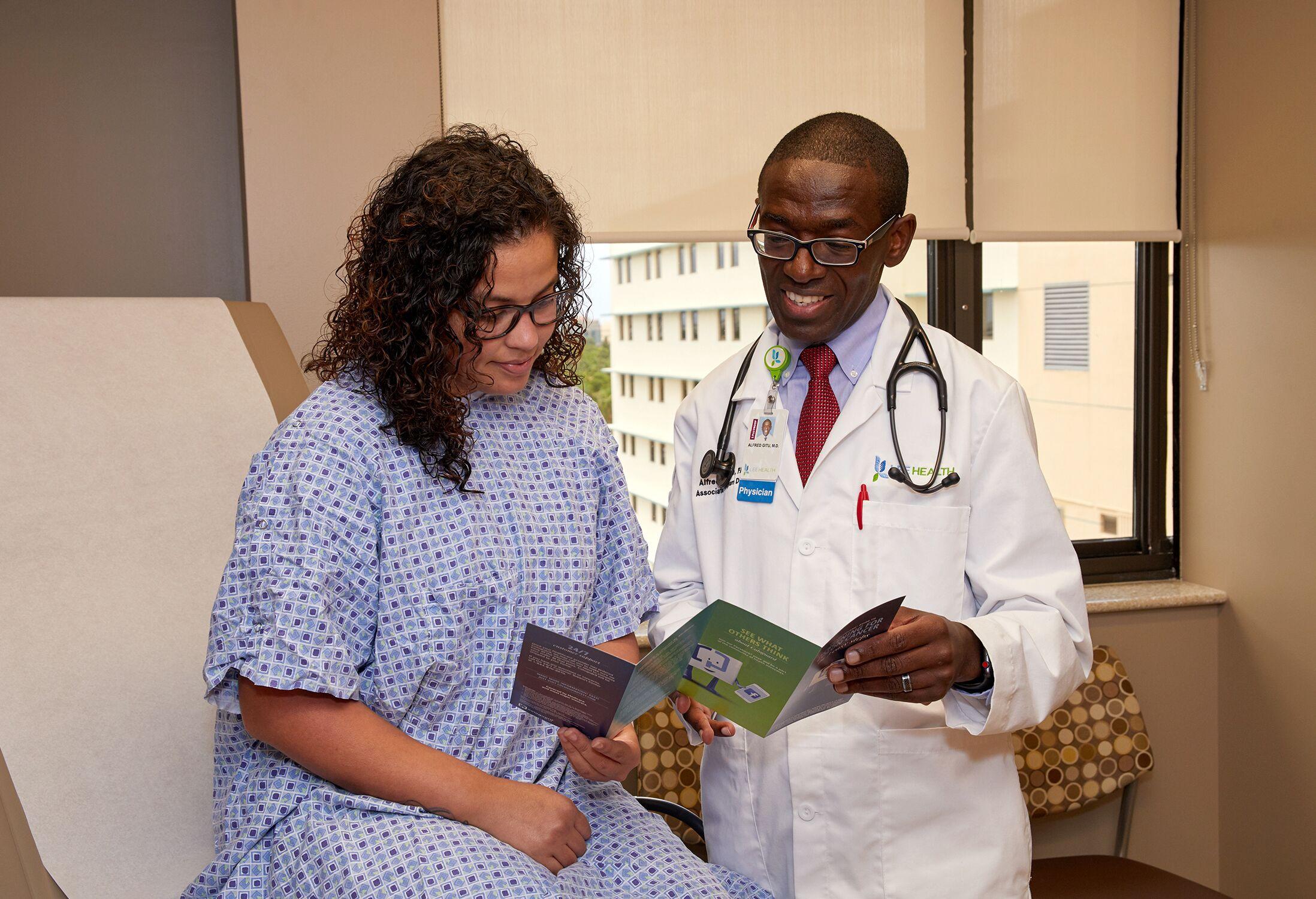 Dr. Gitu with Patient