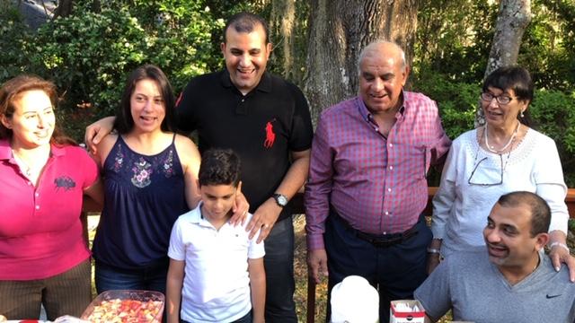 Tamer Tadros with his family, including his mother, father, brother, wife and son