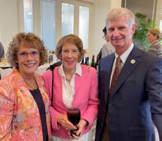 Dr. John Fogarty, Dean of the College of Medicine with his wife Diane, standing with our long time Thomasville medical student supporter, Teresa Brown. 