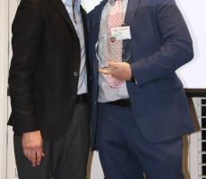 Dean Chaet, M.D. standing next to Kevin Tomecsek, M.D. with the 2026 Outstanding Clinical Faculty Educator Award