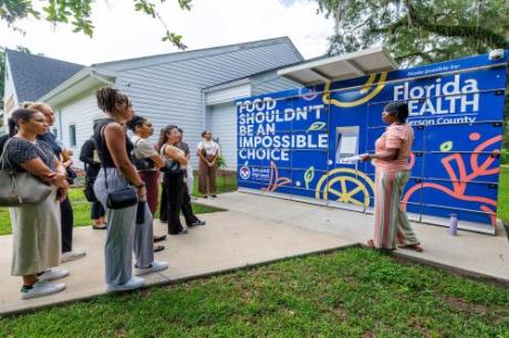 Students on the July 1, 2025 RuLE trip hear about the Jefferson County Health Department's colorful Food Pantry.