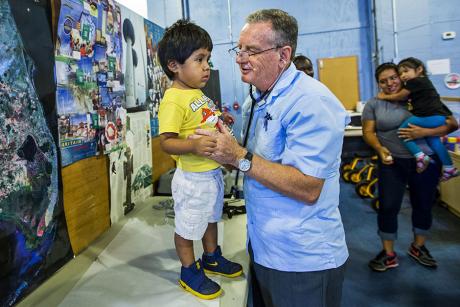 Dr. George Rust talks with a young patient in Quincy, Florida. Photo Credit: Colin Hackley