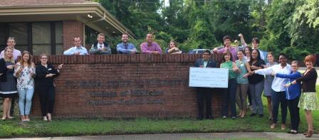 The Class of 2020 pictured in front of our campus with our Dean Dr. Rahangdale, Dr. Christie Alexander, and Executive Director of Capital Medical Society, Pam Irwin, holding a check for $2,000