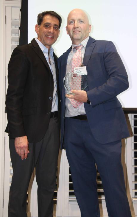 Dean Chaet, M.D. standing next to Kevin Tomecsek, M.D. with the 2026 Outstanding Clinical Faculty Educator Award