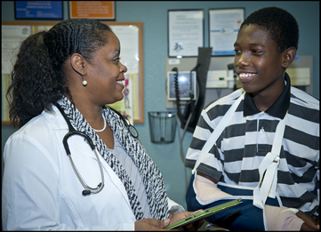 Nickeey Malcolm with patient