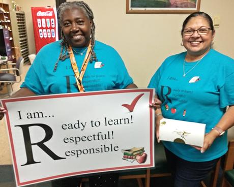 Teacher Sandra Joseph, left, and Maria Pouncey welcome students to Full Summer School.