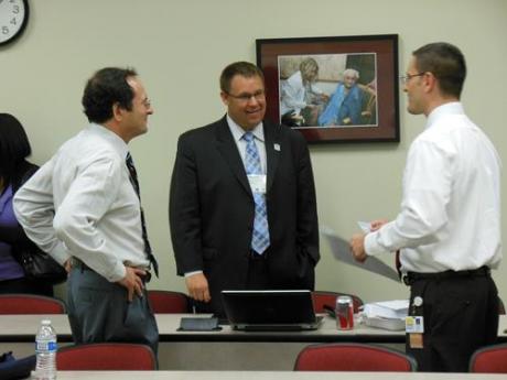 three people in discussing