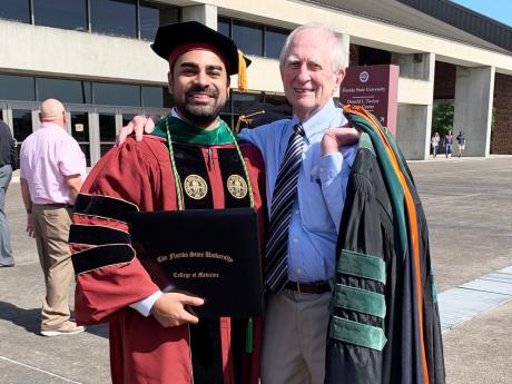 Randy Ahluwalia and College of Medicine professor and mentor Robert Watson.