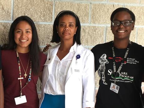 SSTRIDE students Britney Garcia and Ruth Bellevue with Dr. Martine Woodley (pharmacist at Healthcare Network of Southwest Florida).