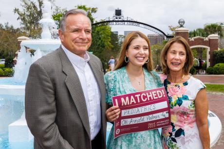 Lauren Smiarowski poses for a Match Day photo with her parents, Mike and Ann Smiarowski, near the Westcott fountain on March 17, 2023.
