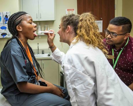 SSTRIDE students attending the Summer Institute practice role-playing as health-care providers.