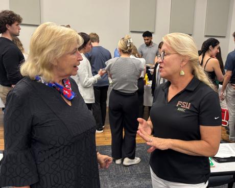 Associate Professor Susan LaJoie talks with Professor Bonnie Spring.