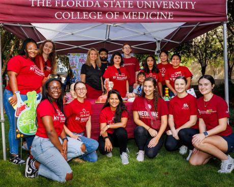 Ph.D. and M.D. students pose for a group photo at the Tallahassee Science Festival.