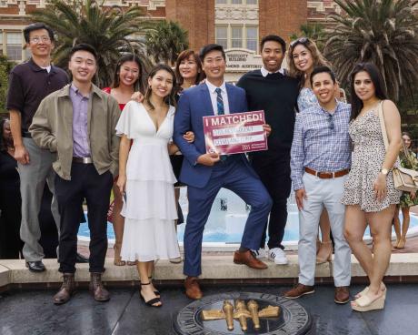 Richard Wu, surrounded by family and friends, poses for the traditional Match Day photo at Westcott fountain on March 17, 2023.