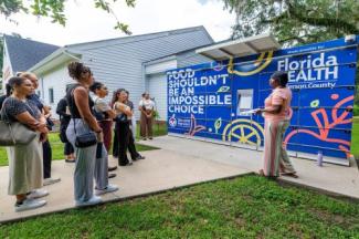 Students on the July 1, 2025 RuLE trip hear about the Jefferson County Health Department's colorful Food Pantry.