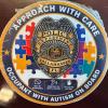 Photo of sticker for auto back window saying "Approach with Care" and "Occupant with Autism on Board" circling a Tallahassee Police Department badge.