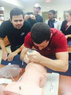 EMIG members practice intubation techniques with help from TMH emergency physicians